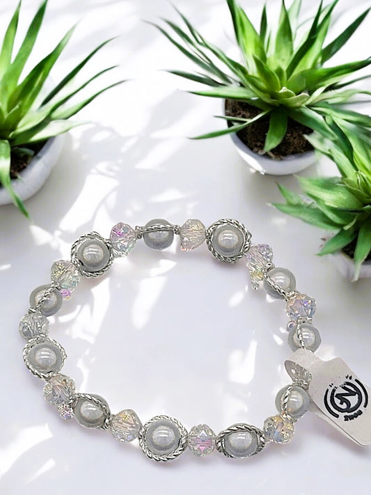 Besondere Magic-Pearls Armbänder mit zusätzl. Glasperlen in versch. Farben